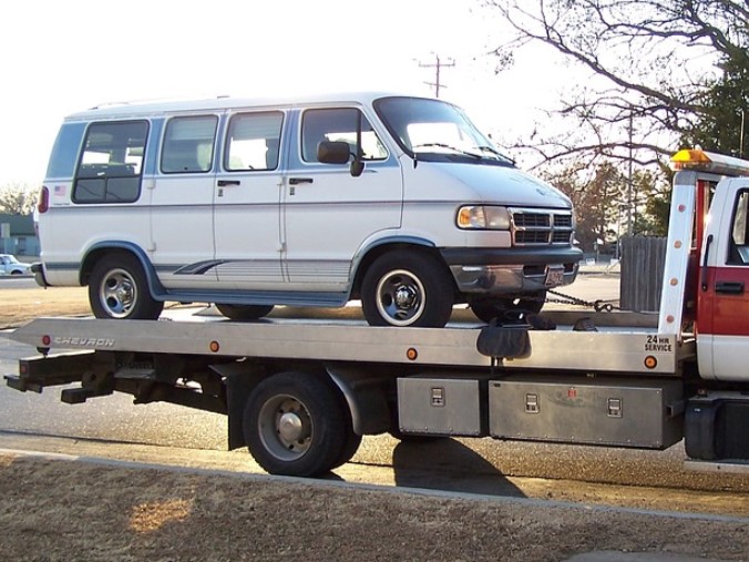 this image shows flatbed towing in Aurora, CO
