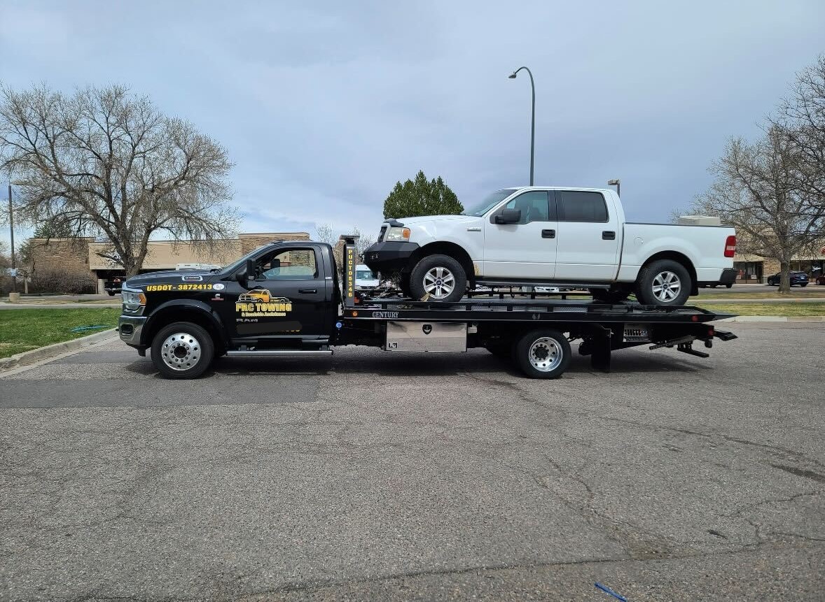 this image shows light truck towing in Aurora, CO